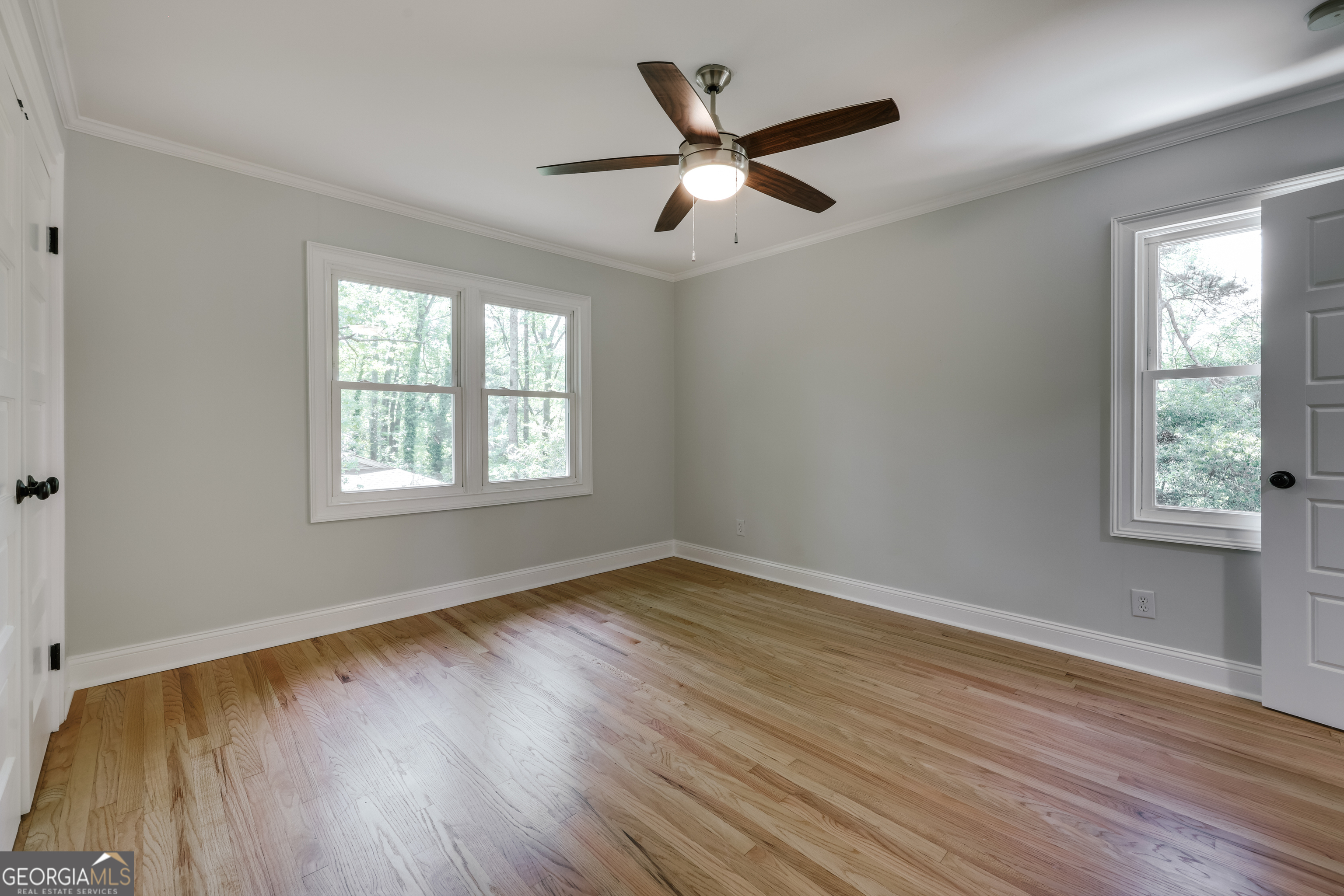 290 Fortson Drive Athens, GA 30606 - Photo 30 of 61 a view of an empty room with wooden floor and a window