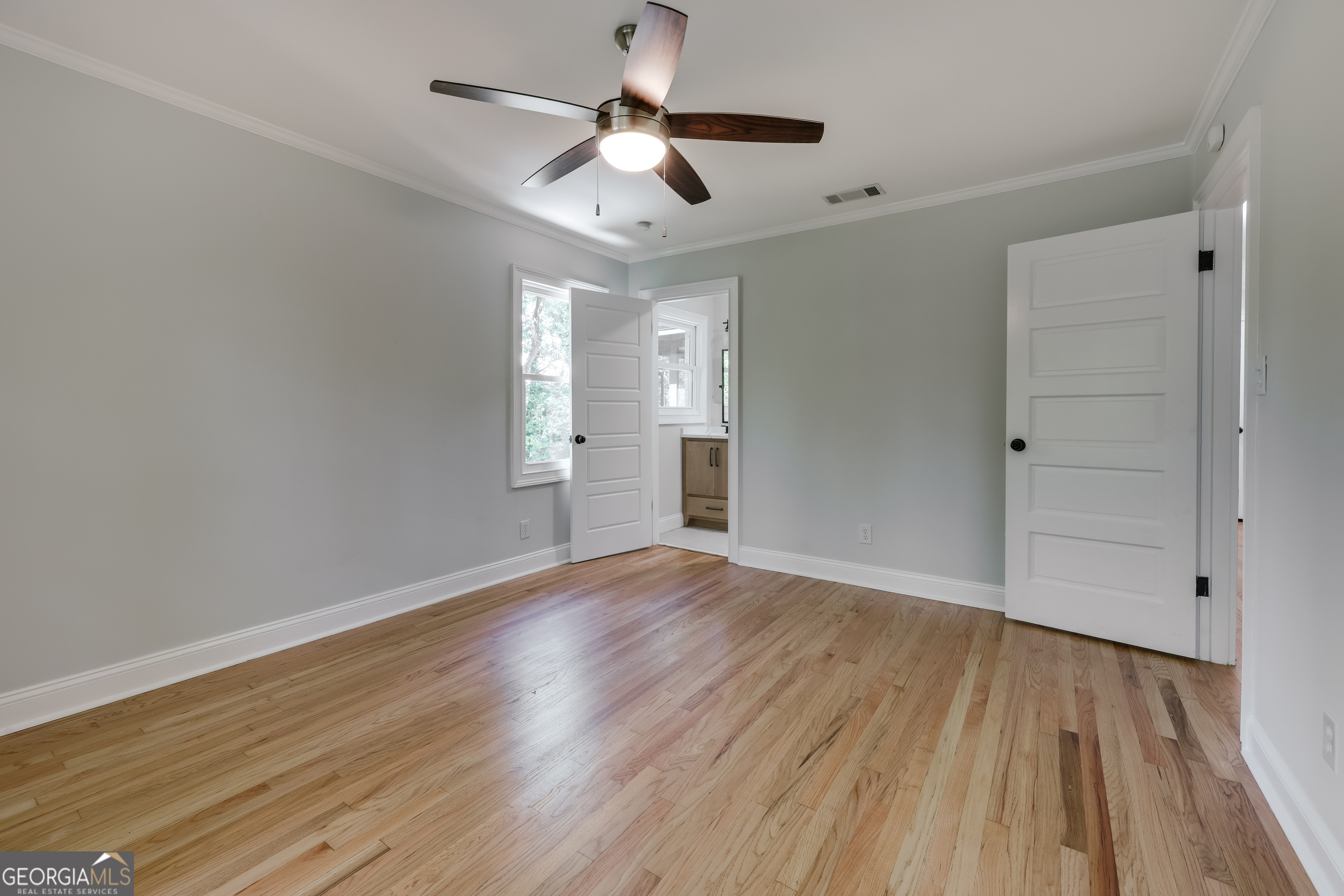 290 Fortson Drive Athens, GA 30606 - Photo 31 of 61 a view of empty room with wooden floor and fan