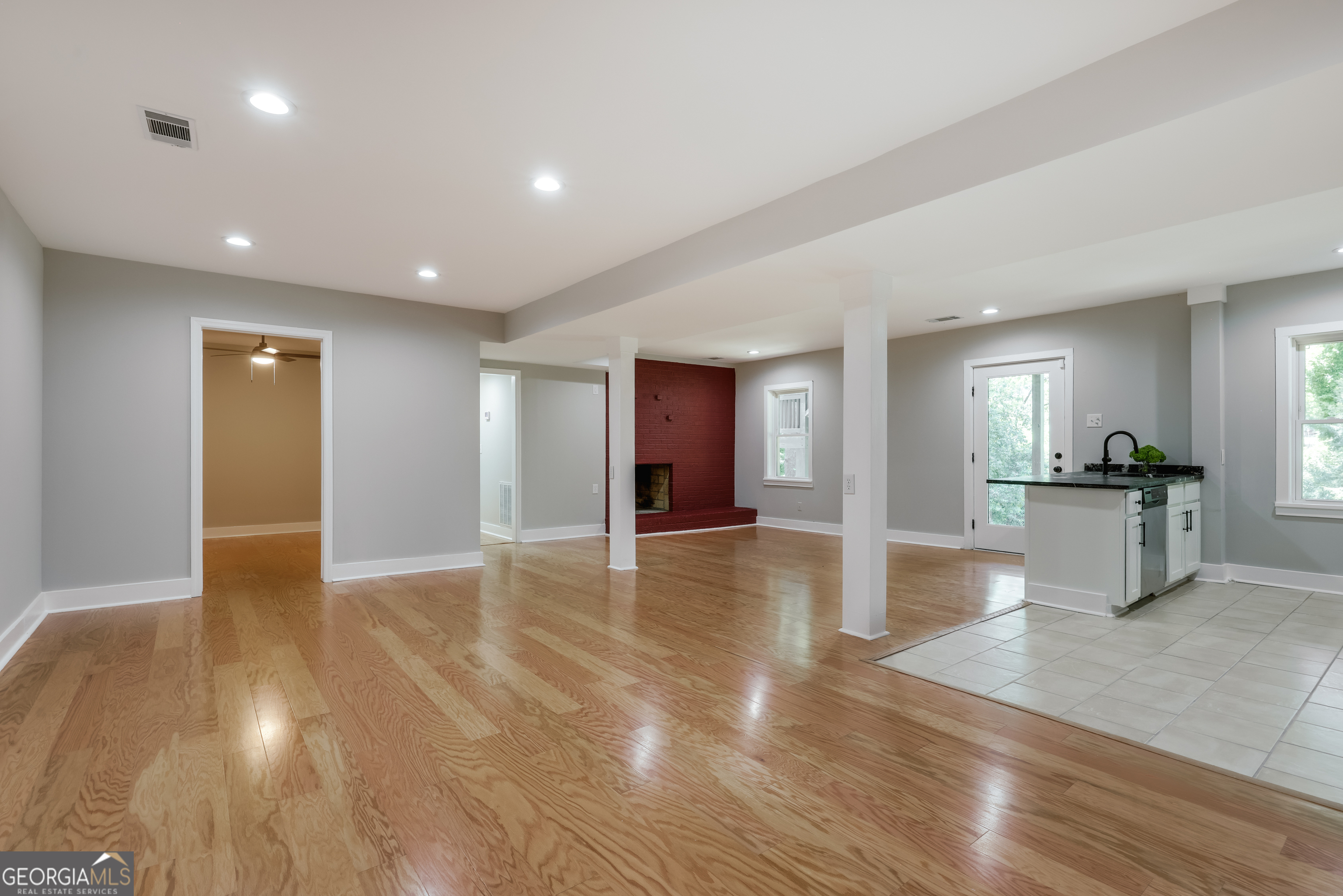 290 Fortson Drive Athens, GA 30606 - Photo 44 of 61 a view of a big room with wooden floor and a kitchen