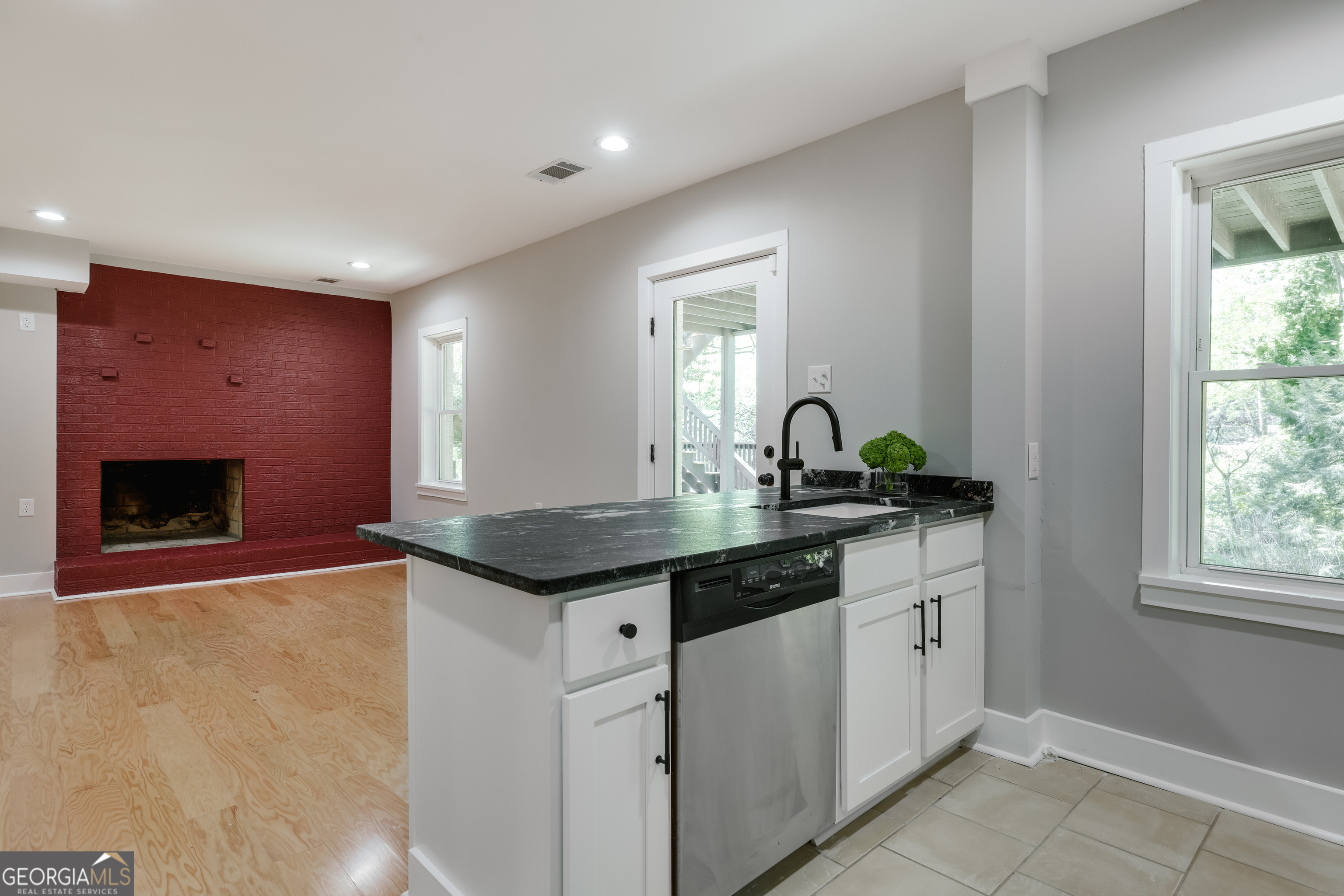 290 Fortson Drive Athens, GA 30606 - Photo 45 of 61 a kitchen with granite countertop a sink and cabinets