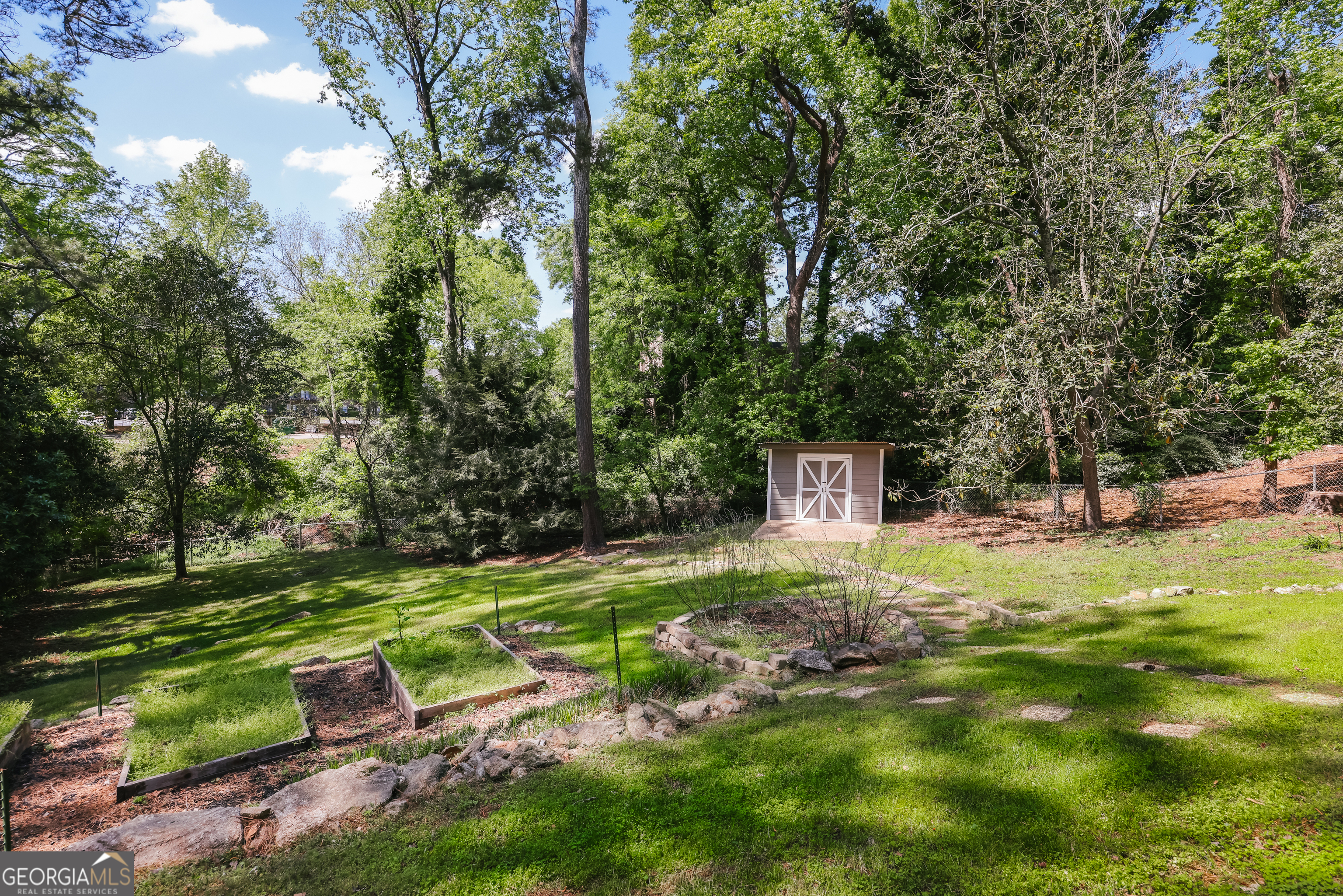290 Fortson Drive Athens, GA 30606 - Photo 57 of 61 a backyard of a house with table and chairs