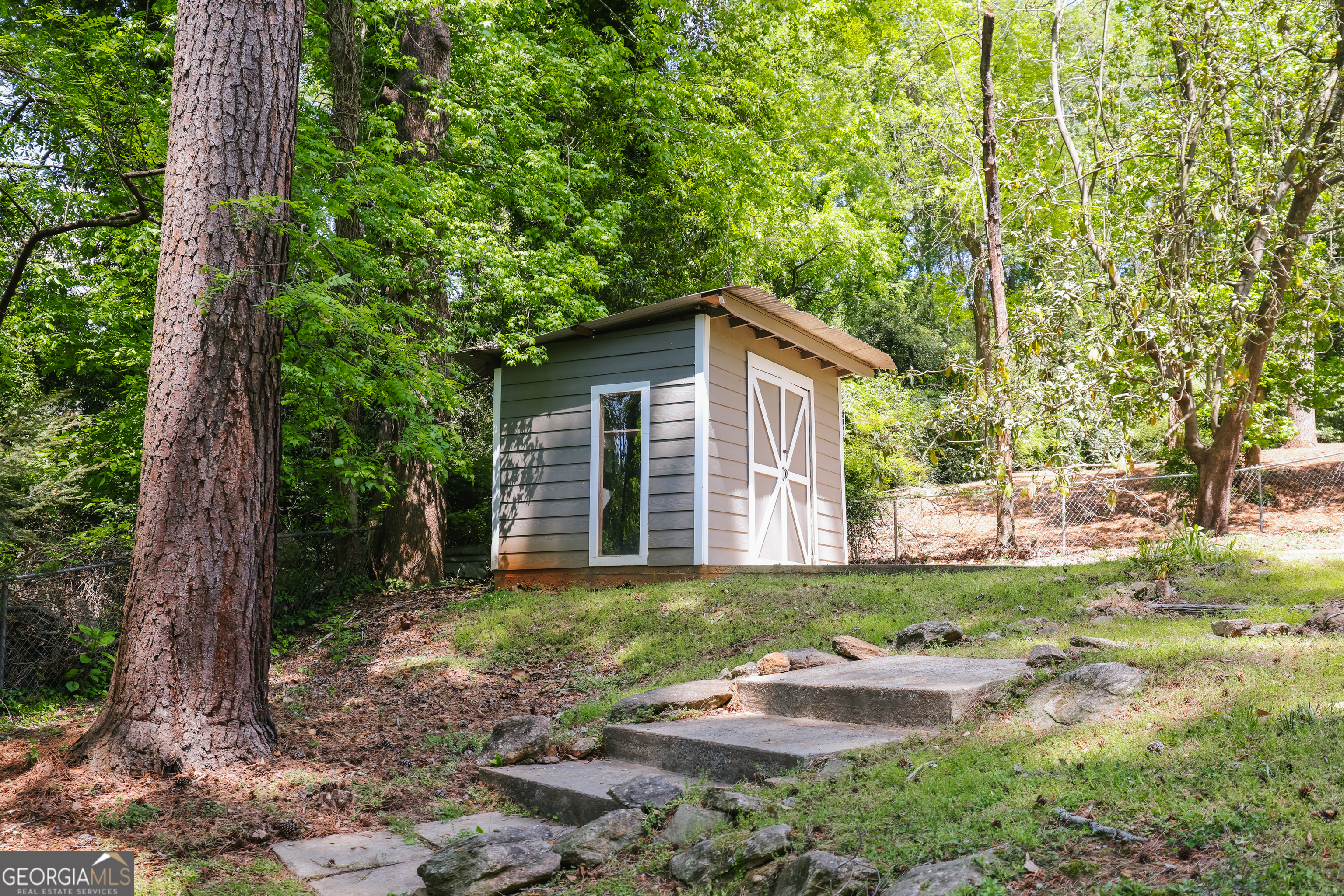 290 Fortson Drive Athens, GA 30606 - Photo 58 of 61 a front view of a house with a yard and trees