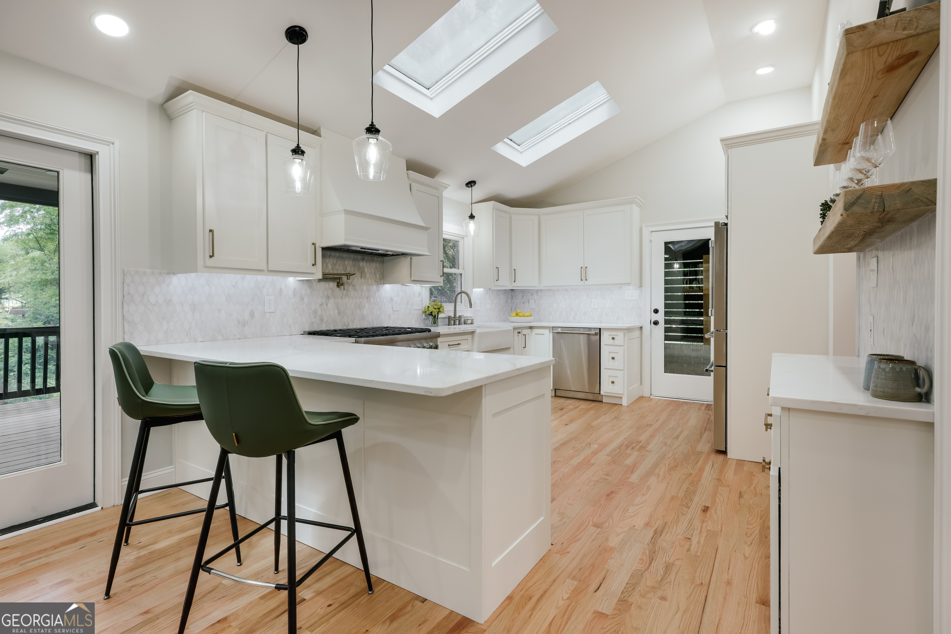 290 Fortson Drive Athens, GA 30606 - Photo 9 of 61 a kitchen with kitchen island a counter top space a sink stainless steel appliances and cabinets