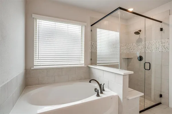 a white bath tub sitting next to a window