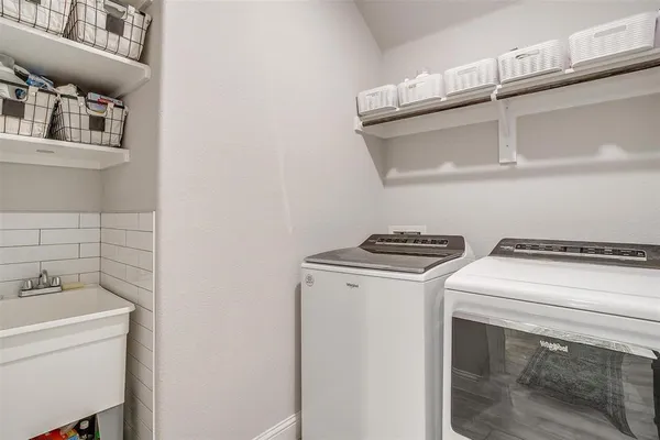 a utility room with dryer and washer
