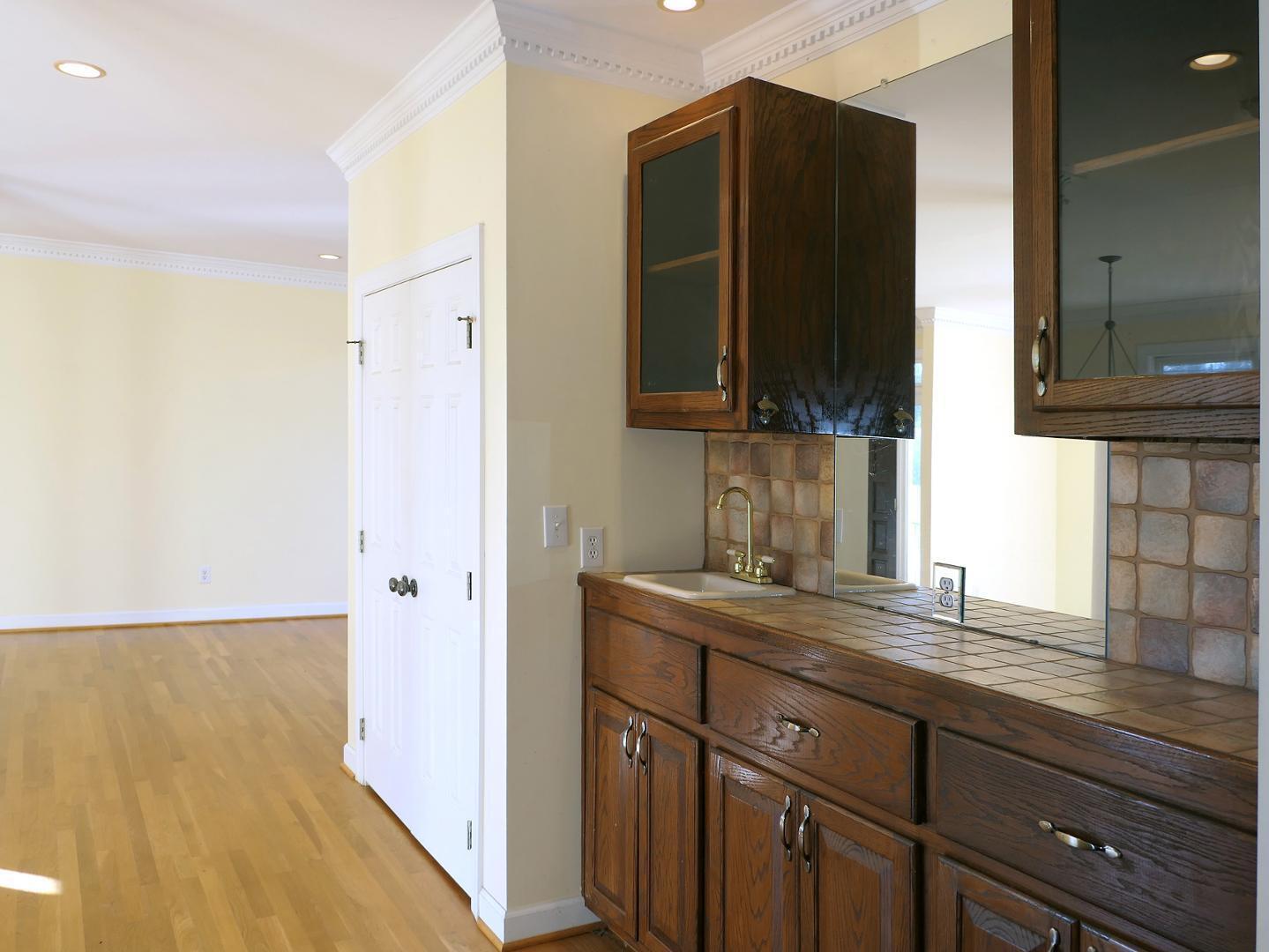 5330 Foxlair Road Chapel Hill, NC 27516 - Photo 11 of 43 a kitchen with a sink and a refrigerator