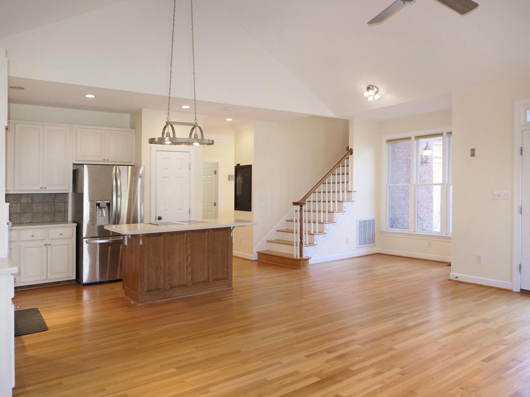 5330 Foxlair Road Chapel Hill, NC 27516 - Photo 12 of 43 a view of kitchen and empty room with wooden floor