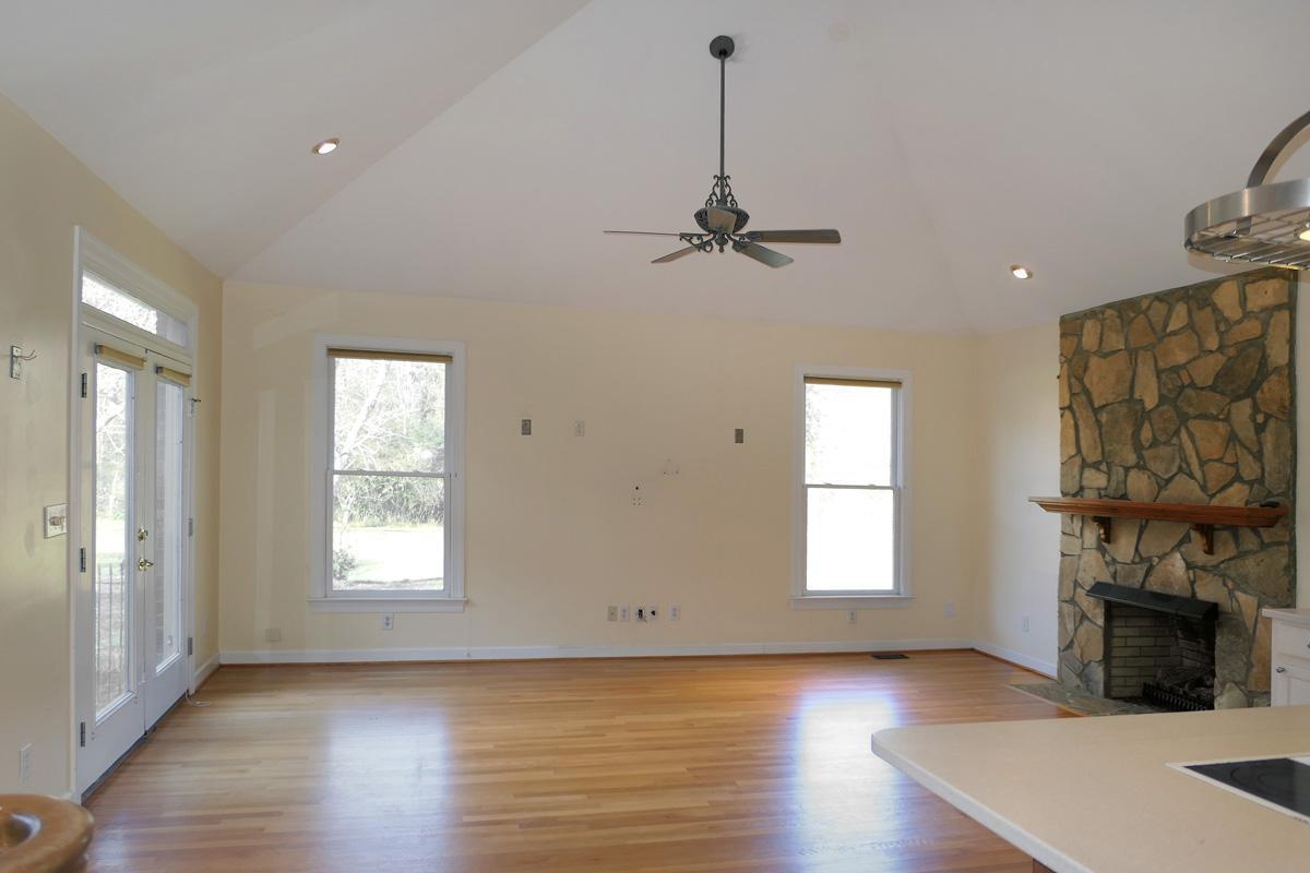 5330 Foxlair Road Chapel Hill, NC 27516 - Photo 13 of 43 a view of a livingroom with a fireplace window and wooden floor