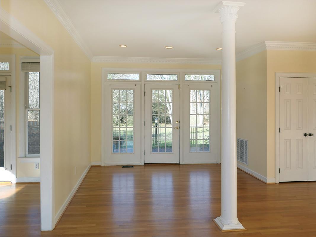 5330 Foxlair Road Chapel Hill, NC 27516 - Photo 2 of 43 an empty room with wooden floor and windows