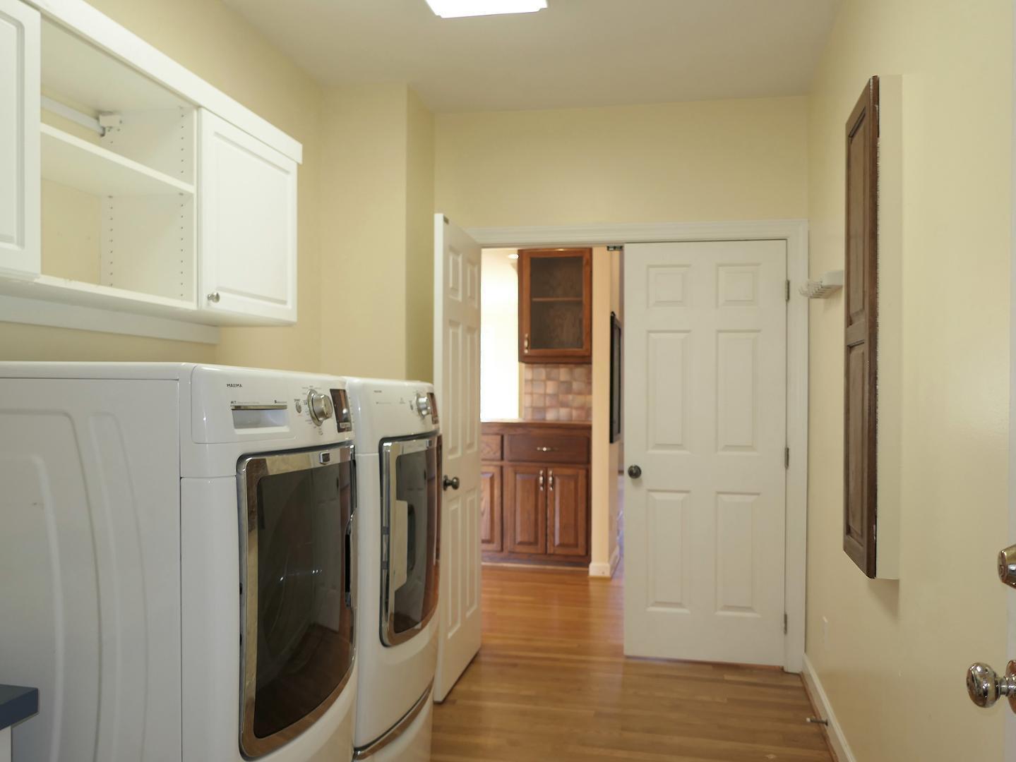 5330 Foxlair Road Chapel Hill, NC 27516 - Photo 24 of 43 a view of a storage and utility room with washer and dryer