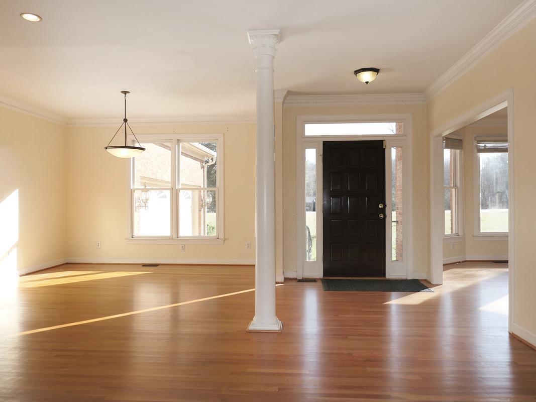 5330 Foxlair Road Chapel Hill, NC 27516 - Photo 3 of 43 an empty room with wooden floor and windows