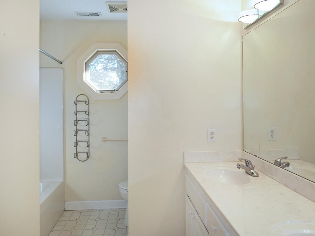 5330 Foxlair Road Chapel Hill, NC 27516 - Photo 33 of 43 a bathroom with a granite countertop sink and a mirror
