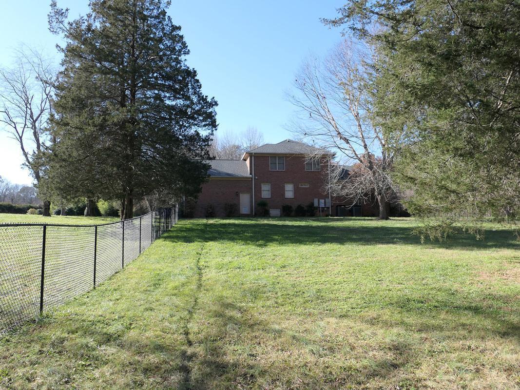 5330 Foxlair Road Chapel Hill, NC 27516 - Photo 40 of 43 a view of a yard with large trees