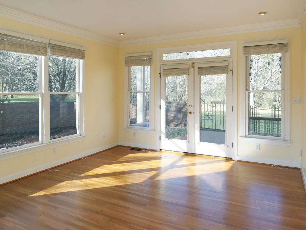 5330 Foxlair Road Chapel Hill, NC 27516 - Photo 4 of 43 a view of an empty room with wooden floor and a window
