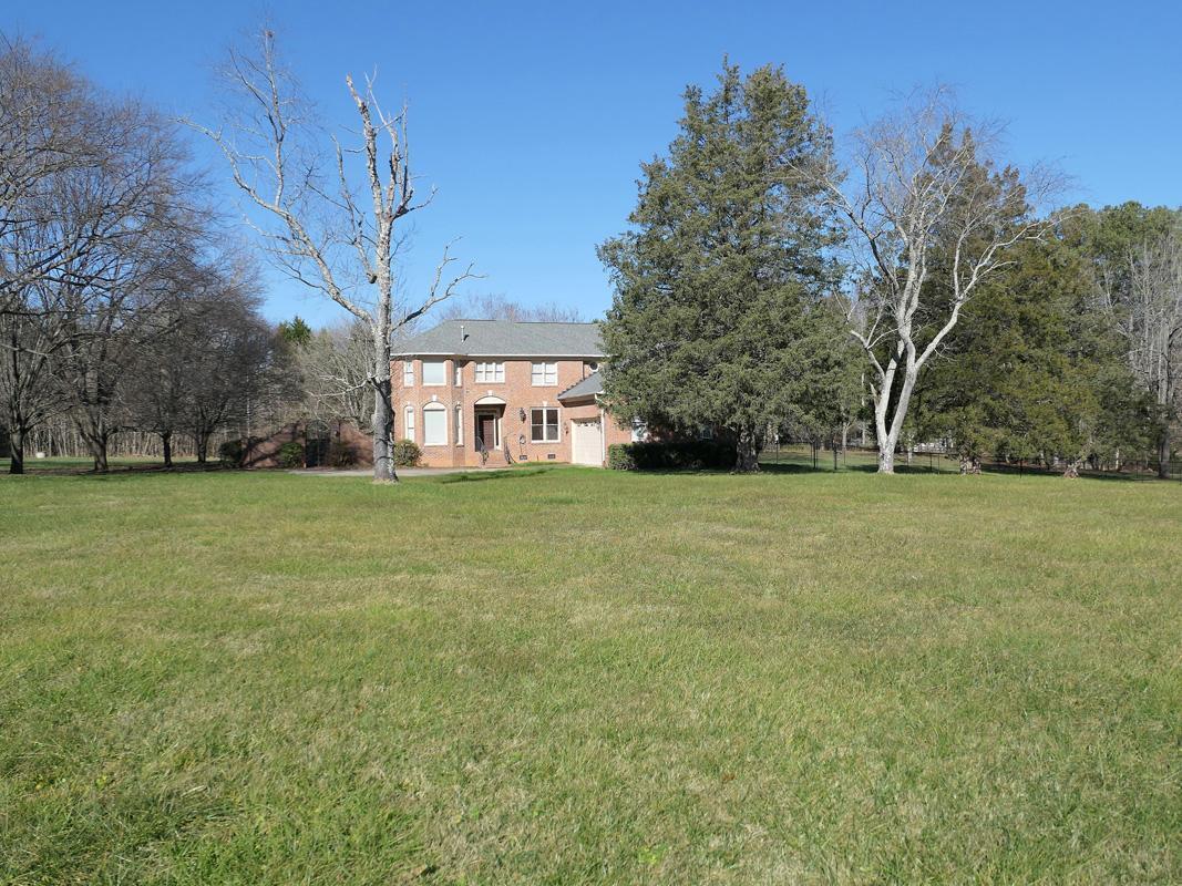 5330 Foxlair Road Chapel Hill, NC 27516 - Photo 42 of 43 a view of a yard with a house in the background