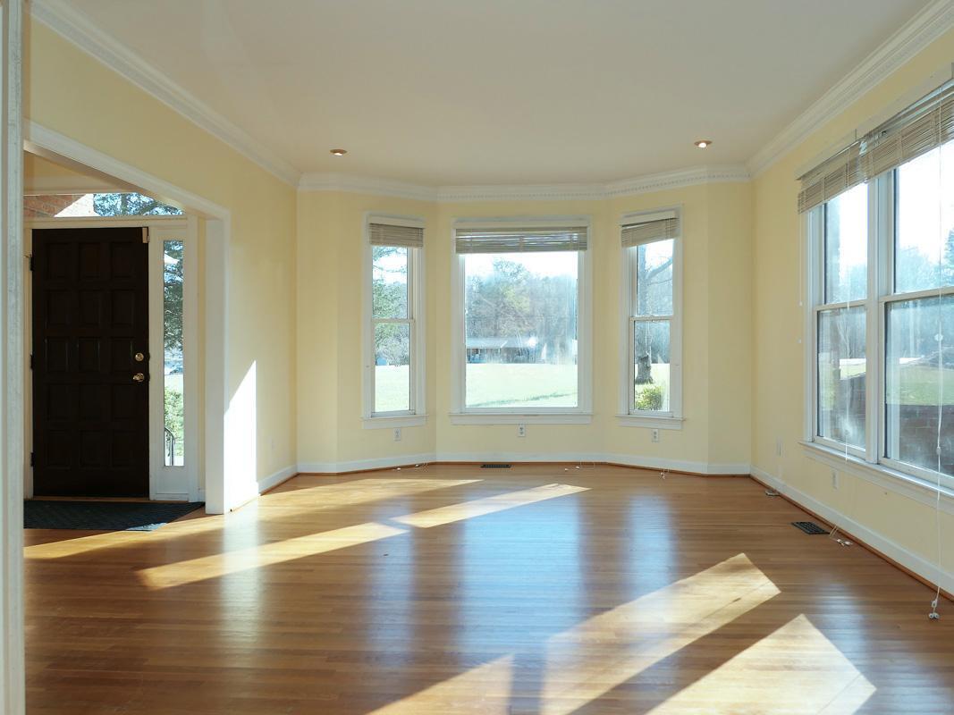 5330 Foxlair Road Chapel Hill, NC 27516 - Photo 5 of 43 a view of empty room with wooden floor and fan