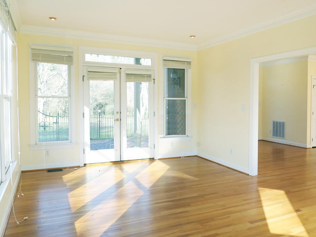 5330 Foxlair Road Chapel Hill, NC 27516 - Photo 6 of 43 a view of an empty room with wooden floor and a window