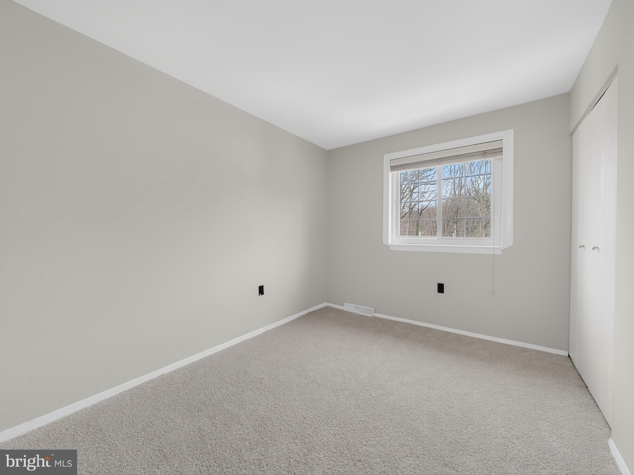 8040 Sandy Spring Road, Unit 8040 Laurel, MD 20707 - Photo 22 of 44 an empty room with windows