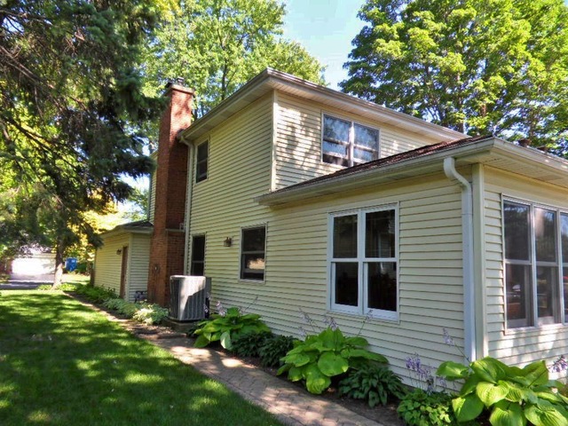 511 Post Road St. Charles, IL 60174 - Photo 24 of 25 a front view of a house with a yard