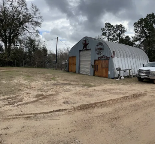 a view of a car park in front of a house