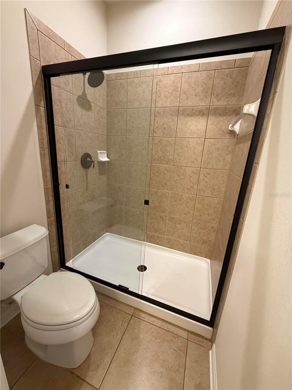 11342 77th Street East Parrish, FL 34219 - Photo 20 of 31 a bathroom with a toilet and a shower