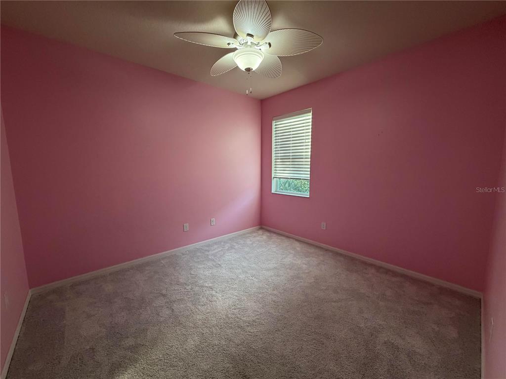 11342 77th Street East Parrish, FL 34219 - Photo 21 of 31 an empty room with a fan and a window