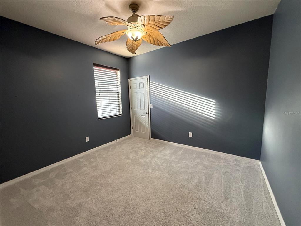 11342 77th Street East Parrish, FL 34219 - Photo 22 of 31 a view of an empty room with a window