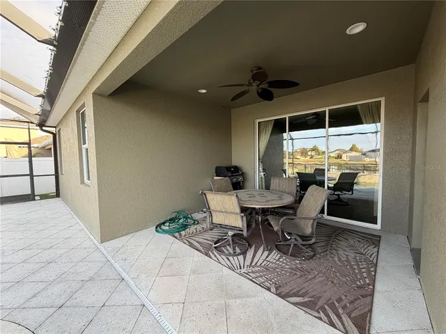 a view of swimming pool with a lounge chairs