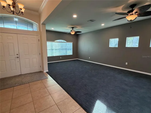 a kitchen with a refrigerator and a sink