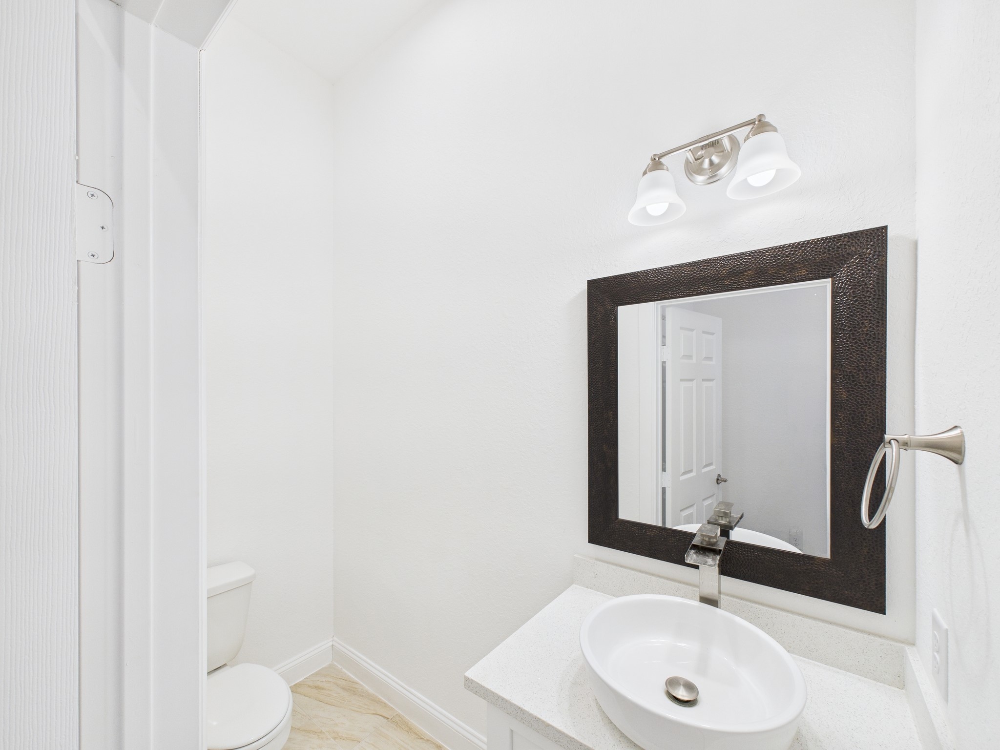 4619 Stassen Street, Unit B Houston, TX 77051 - Photo 11 of 29 a bathroom with a sink and a mirror