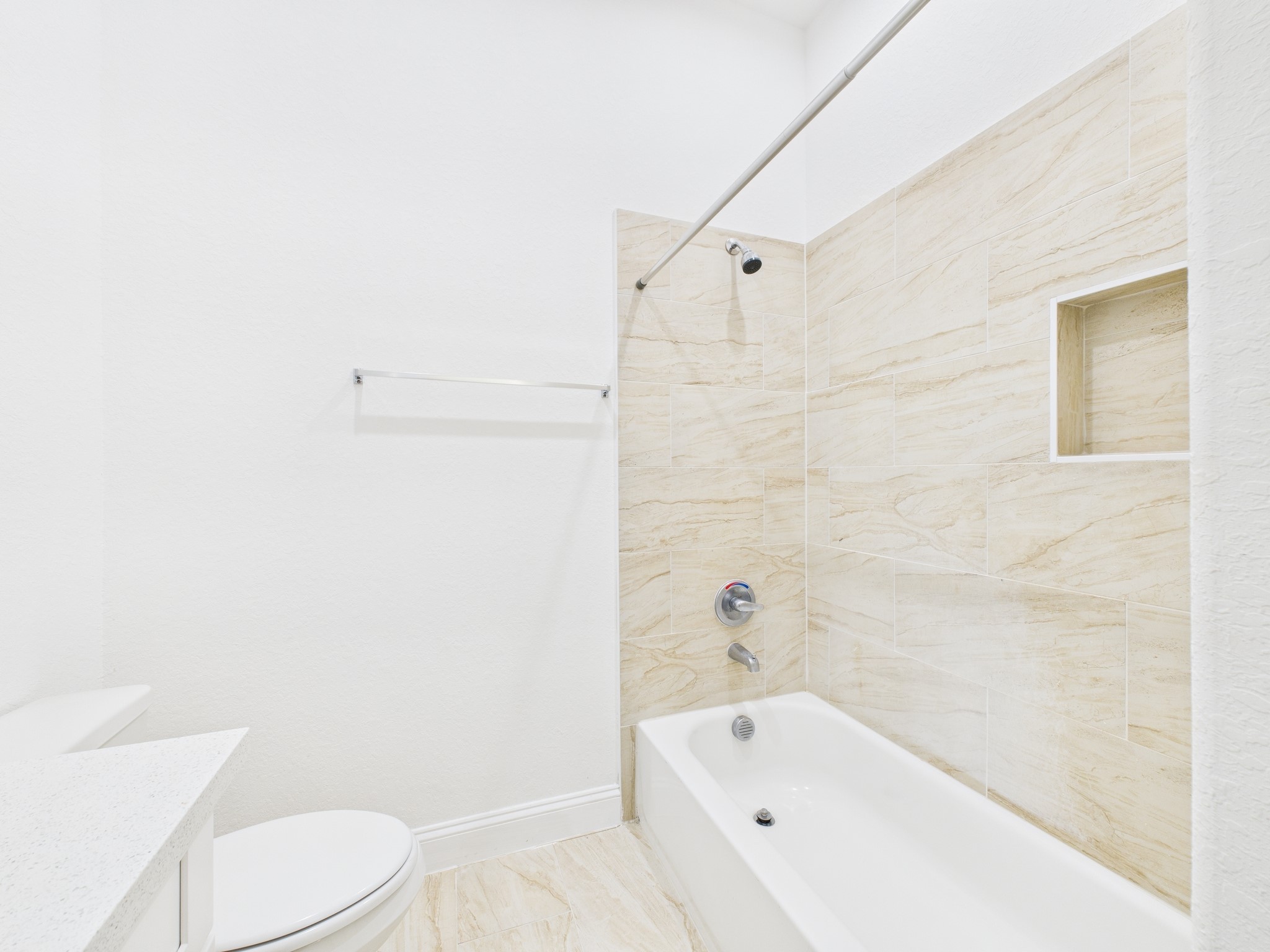 4619 Stassen Street, Unit B Houston, TX 77051 - Photo 17 of 29 a bathroom with a bathtub and toilet