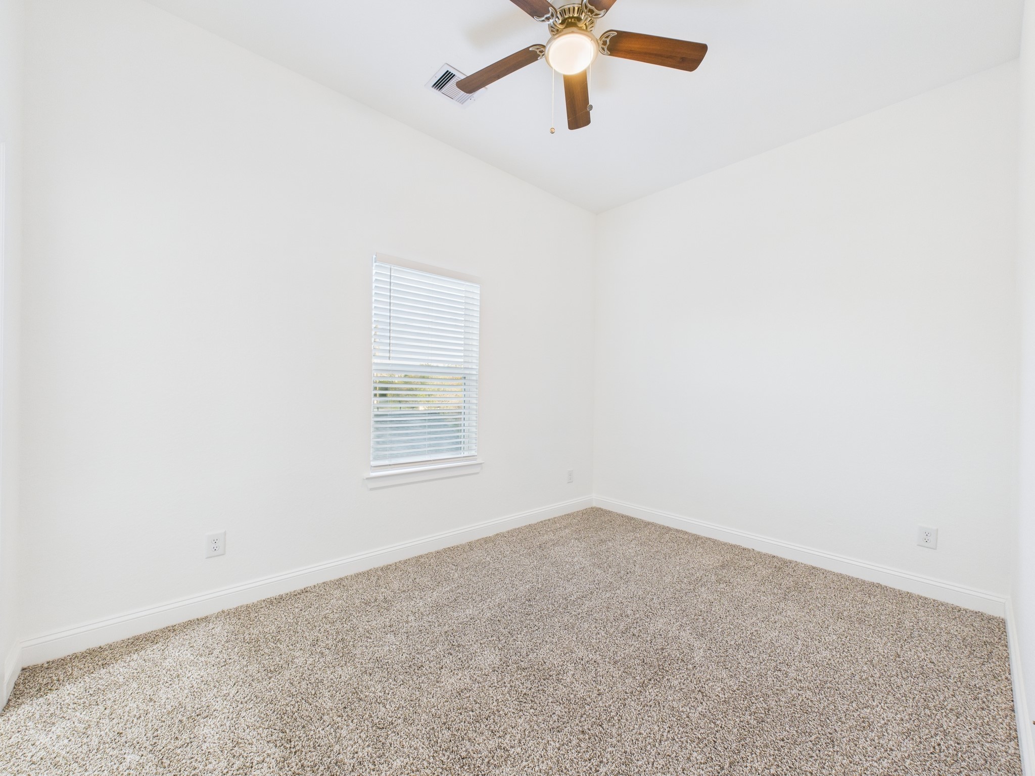 4619 Stassen Street, Unit B Houston, TX 77051 - Photo 19 of 29 an empty room with a window and a fan