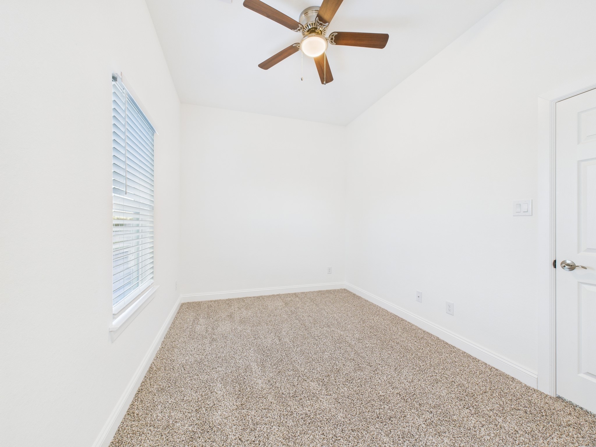 4619 Stassen Street, Unit B Houston, TX 77051 - Photo 20 of 29 an empty room with a window and a fan