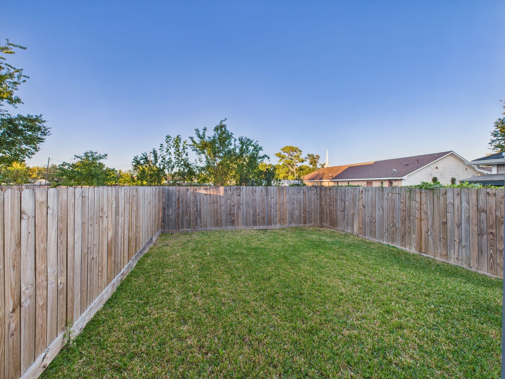 4619 Stassen Street, Unit B Houston, TX 77051 - Photo 29 of 29 a view of a backyard with wooden fence