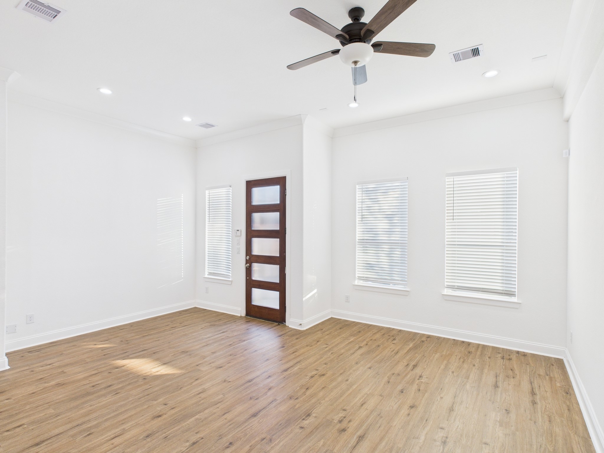 4619 Stassen Street, Unit B Houston, TX 77051 - Photo 4 of 29 wooden floor in an empty room with a window