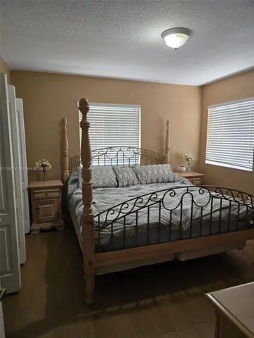 a view of a room with gym equipment and a window