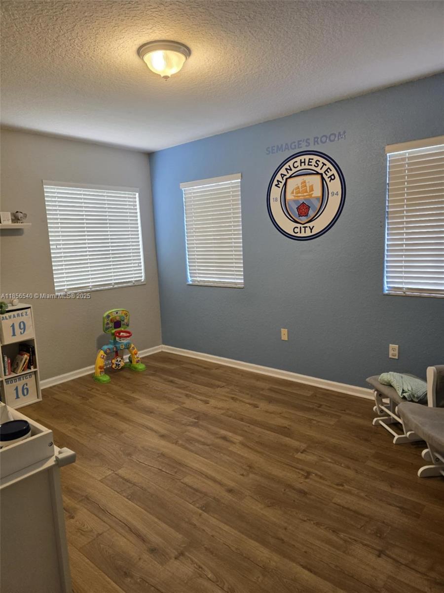 13994 Southwest 278th Street Homestead, FL 33032 - Photo 15 of 19 a view of a room with gym equipment and a window