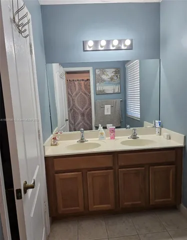 a bathroom with a toilet and shower curtain