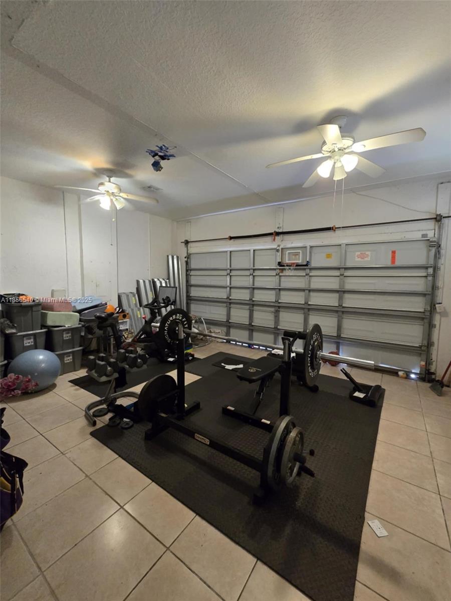 13994 Southwest 278th Street Homestead, FL 33032 - Photo 18 of 19 a view of a room with gym equipment