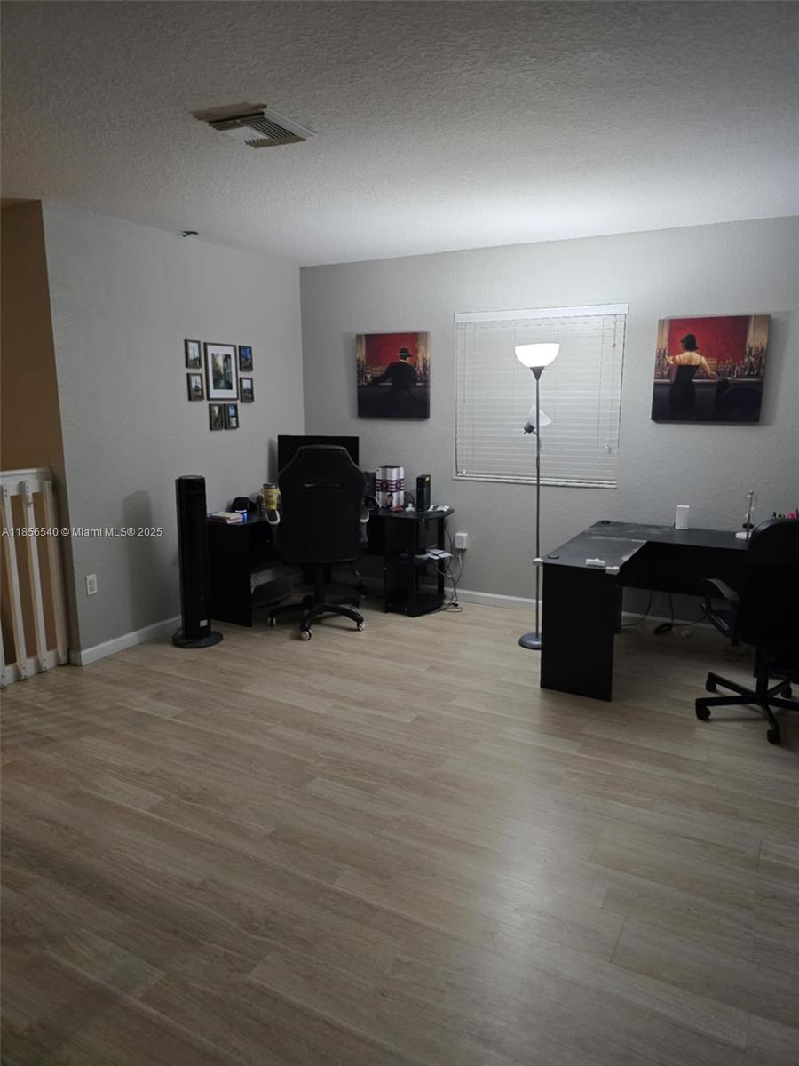 13994 Southwest 278th Street Homestead, FL 33032 - Photo 7 of 19 a living room with furniture and a flat screen tv