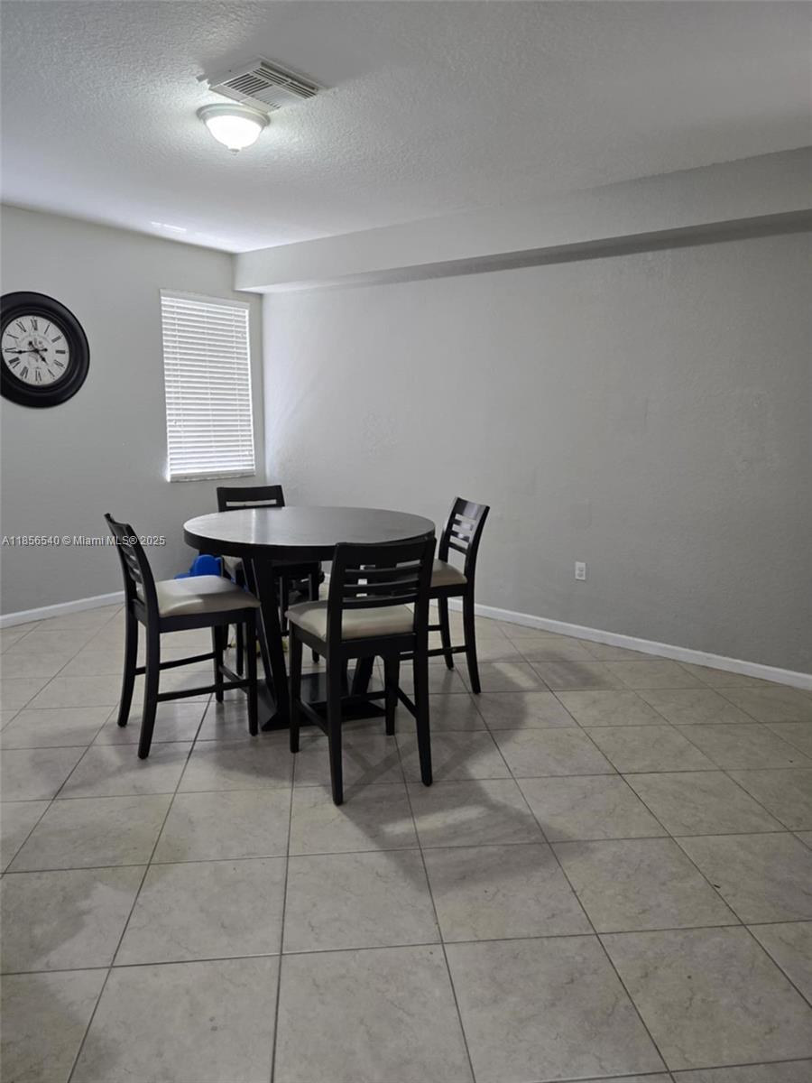 13994 Southwest 278th Street Homestead, FL 33032 - Photo 9 of 19 a view of a dining room with furniture