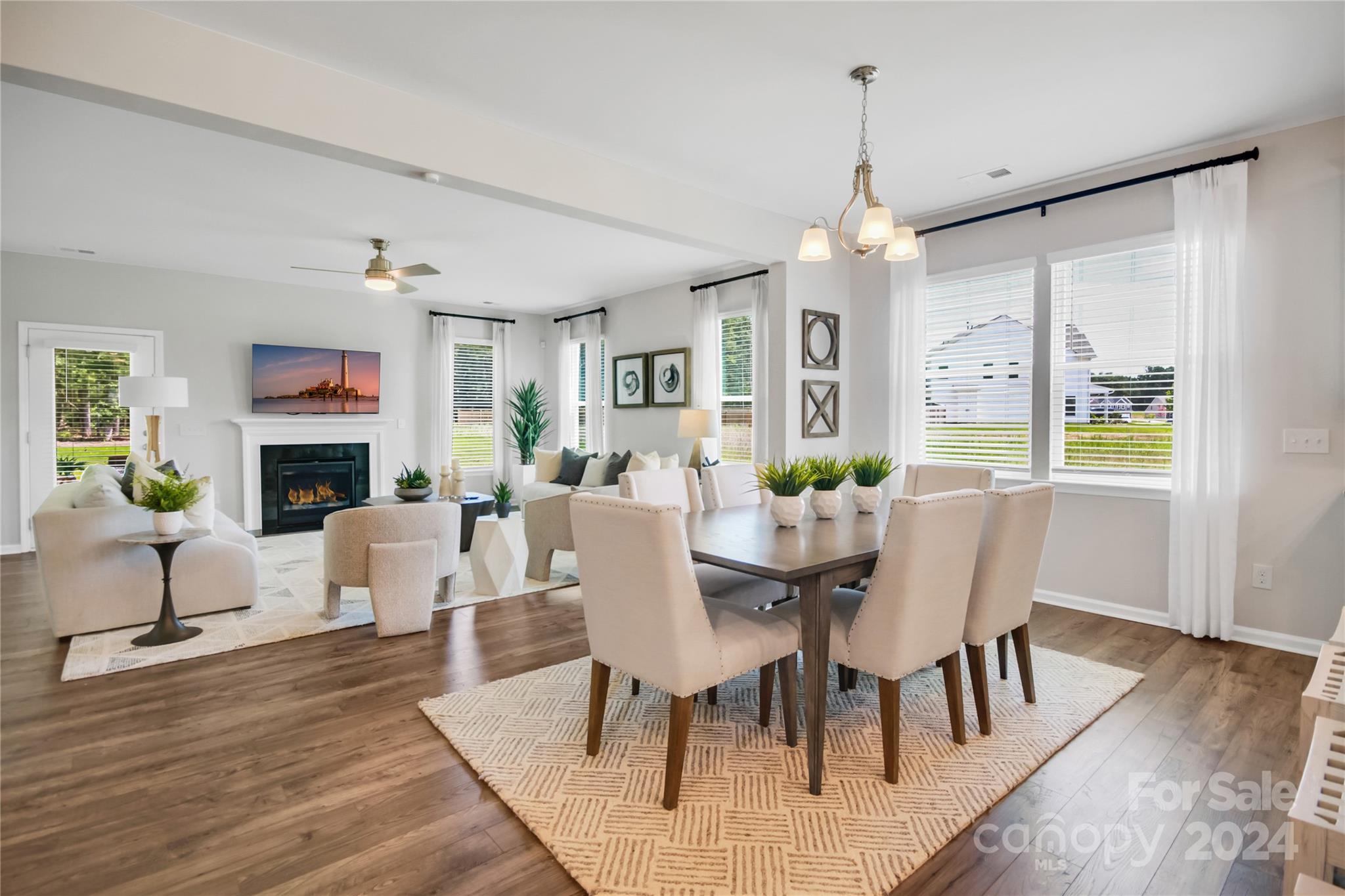 3174 Laurel Brook Drive Denver, NC 28037 - Photo 12 of 32 a view of a dining room with furniture window and wooden floor