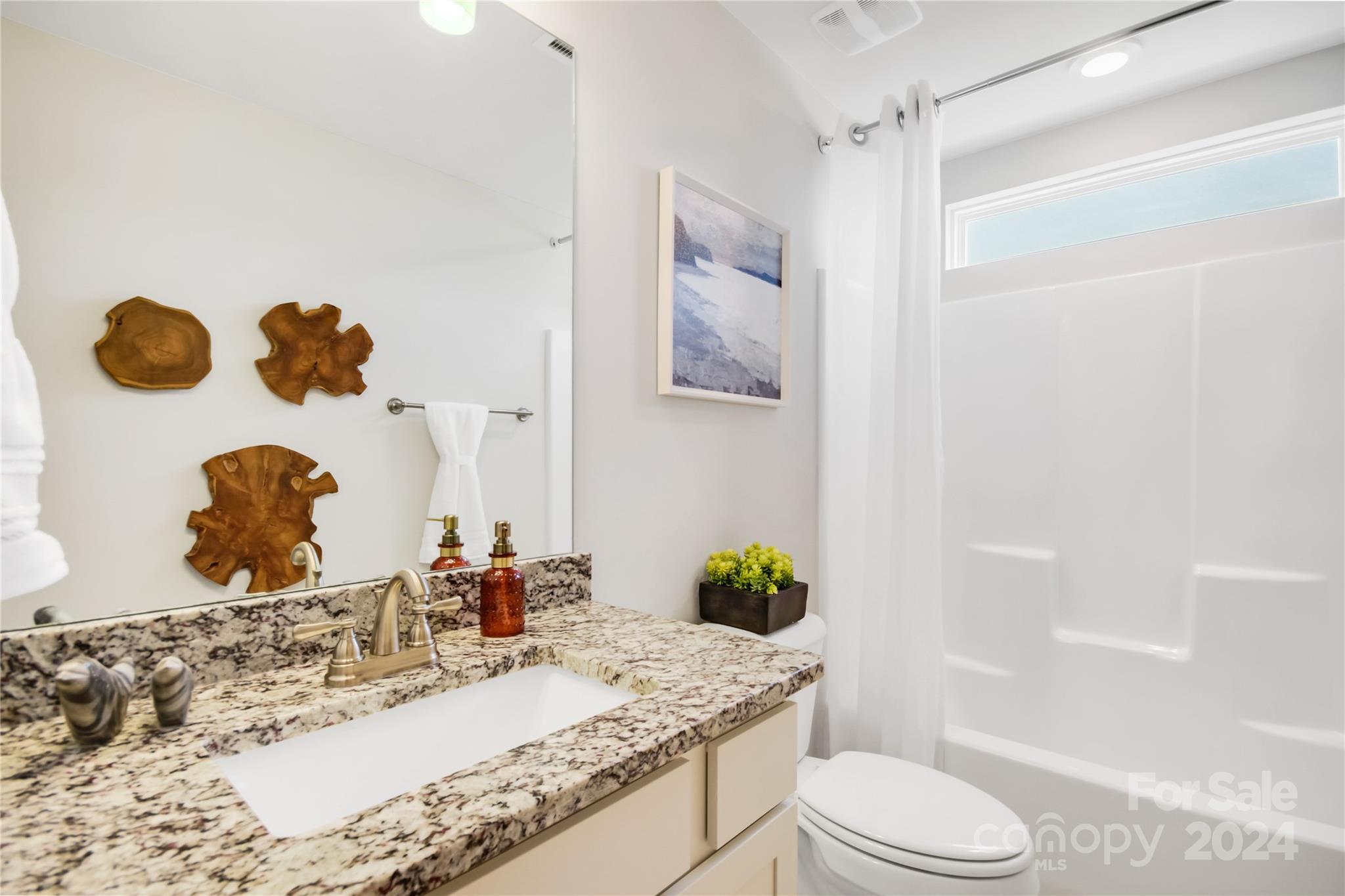 3174 Laurel Brook Drive Denver, NC 28037 - Photo 23 of 32 a bathroom with a granite countertop sink and a mirror