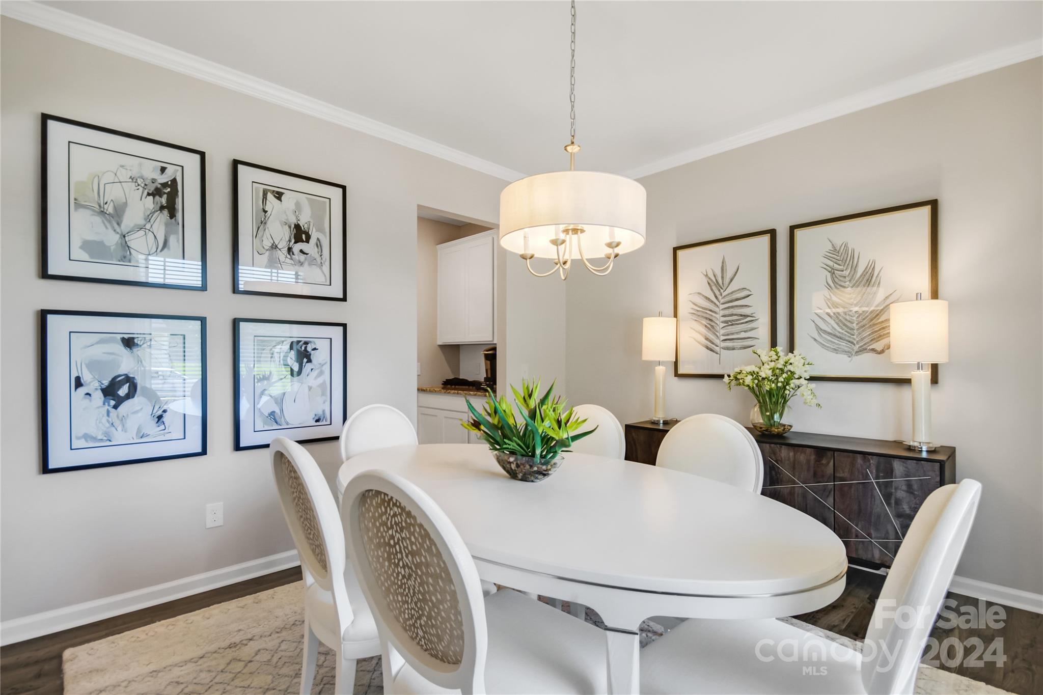 3174 Laurel Brook Drive Denver, NC 28037 - Photo 6 of 32 a dining room with furniture a large window and wooden floor