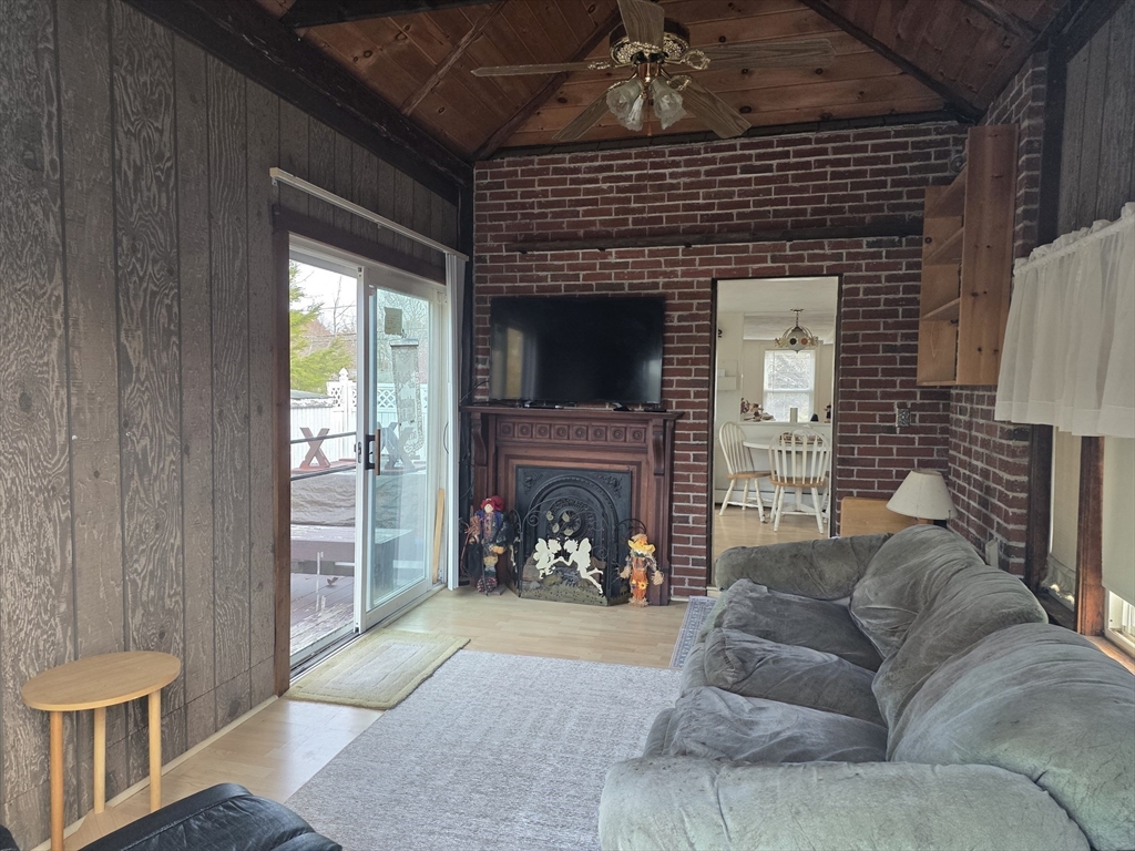 304 High Street Randolph, MA 02368 - Photo 11 of 35 a living room with furniture and a fireplace