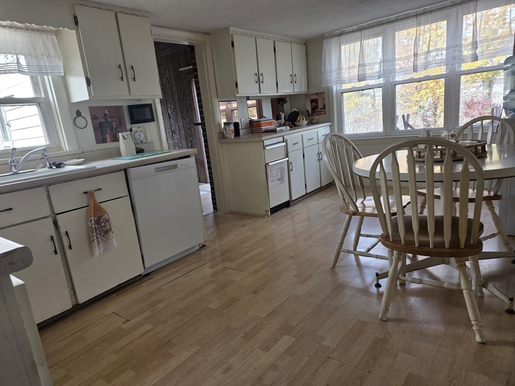304 High Street Randolph, MA 02368 - Photo 12 of 35 a kitchen with cabinets a sink a counter space and stainless steel appliances