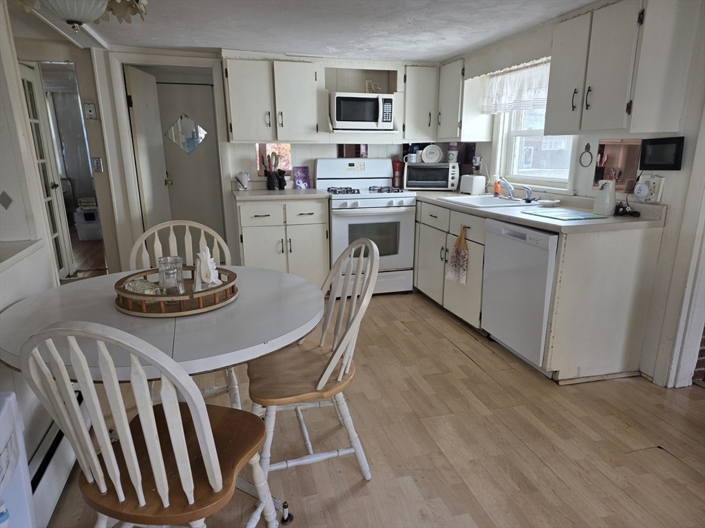 304 High Street Randolph, MA 02368 - Photo 13 of 35 a kitchen with a sink cabinets and window