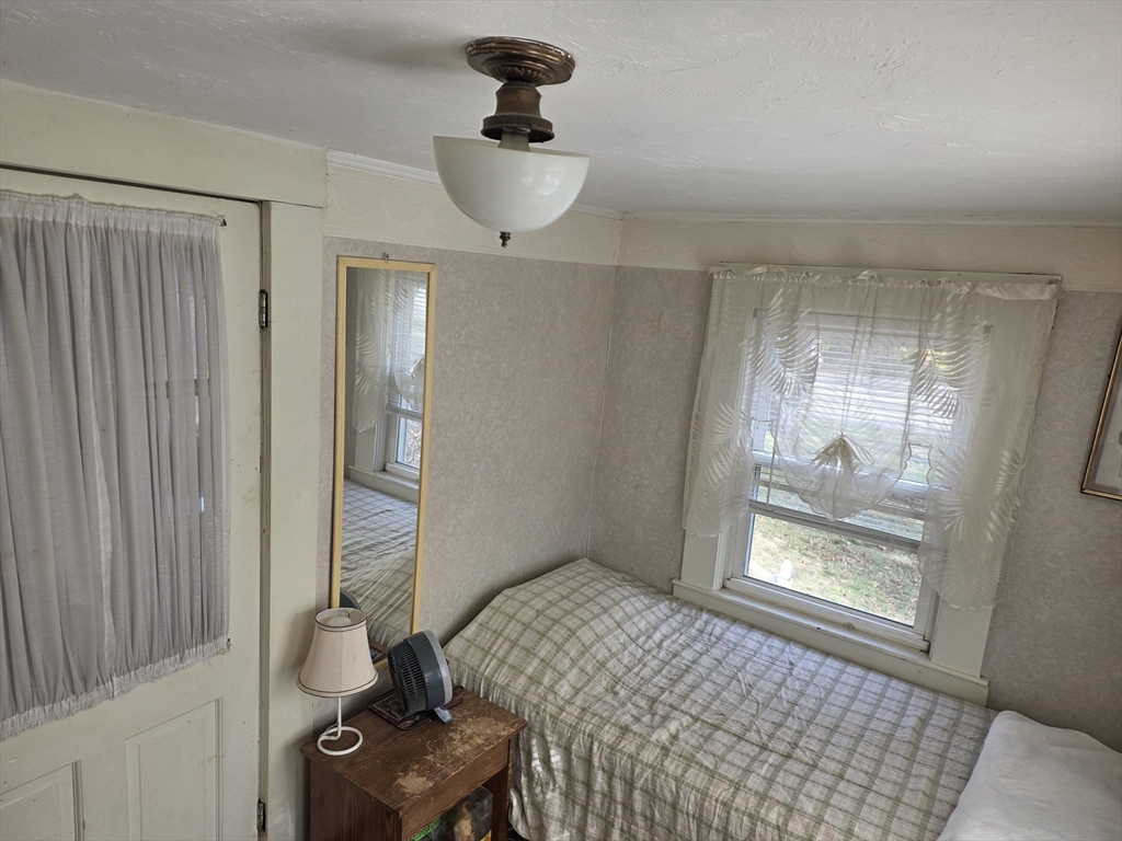304 High Street Randolph, MA 02368 - Photo 21 of 35 a bedroom with a bed and a window