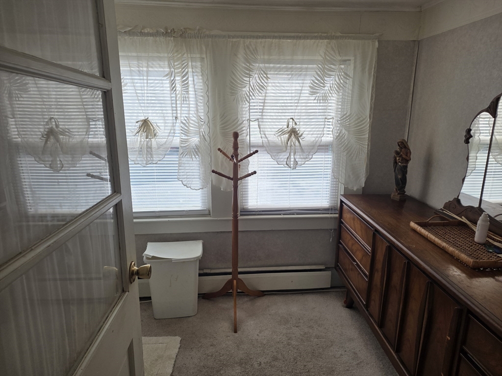 304 High Street Randolph, MA 02368 - Photo 22 of 35 a room with a wooden floor and white doors