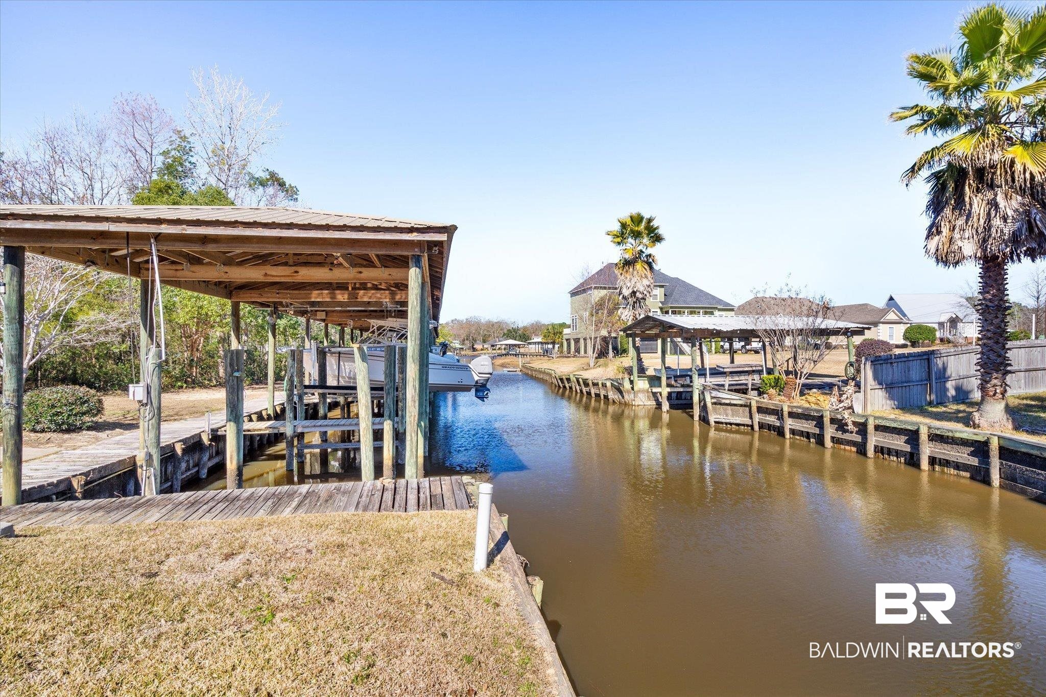 5683 Spring Landing Drive Theodore, AL 36582 - Photo 36 of 49 View of dock with a water view